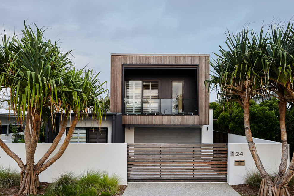Contemporary two-storey multi-coloured house exterior in Gold Coast - Tweed with mixed siding and a flat roof.