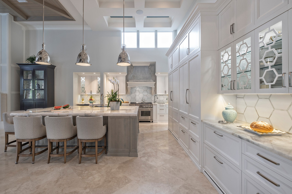 Huge transitional l-shaped beige floor eat-in kitchen photo in Miami with recessed-panel cabinets, white cabinets, marble countertops, white backsplash, porcelain backsplash, paneled appliances, an island and gray countertops