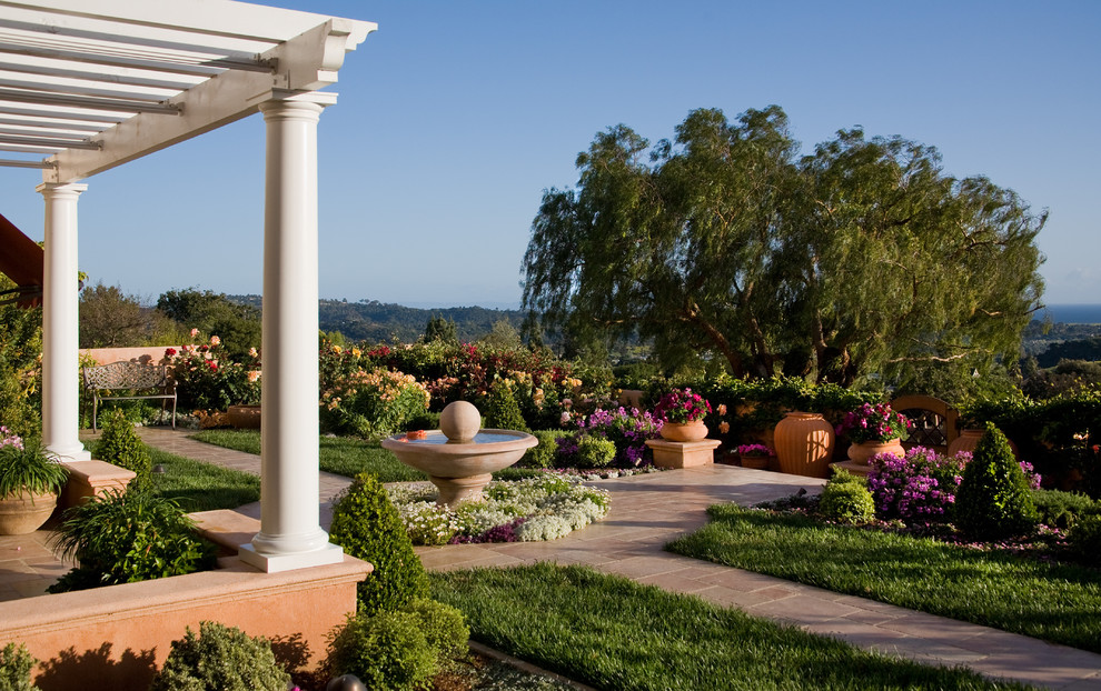 Traditional garden in Santa Barbara with natural stone pavers.