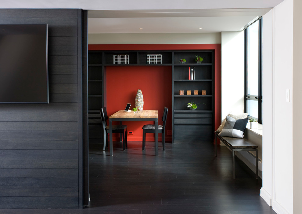 Mid-sized contemporary home office in Chicago with red walls, dark hardwood floors and a freestanding desk.