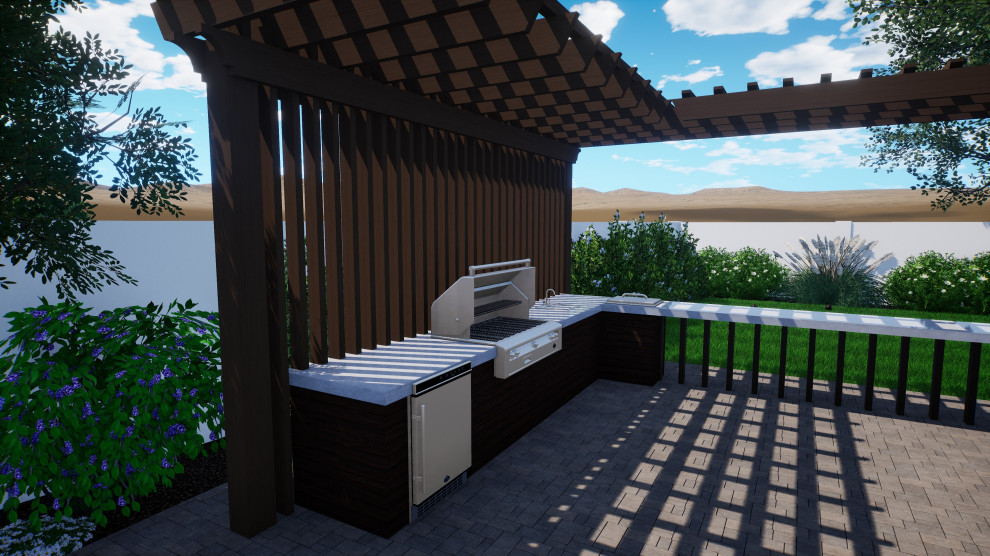 Design ideas for a transitional backyard patio in Phoenix with an outdoor kitchen, natural stone pavers and a pergola.