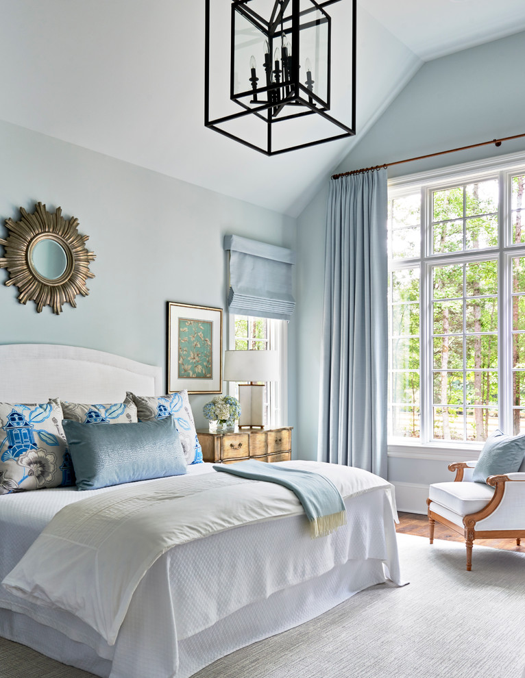 Traditional master bedroom in Charlotte with blue walls.