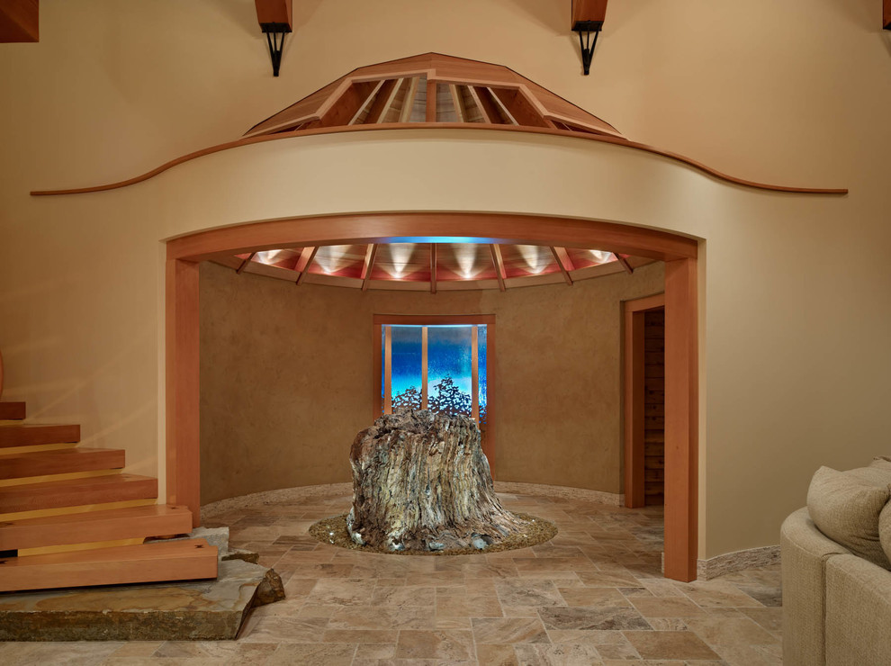 Inspiration for a large rustic ceramic tile foyer remodel in Seattle with beige walls