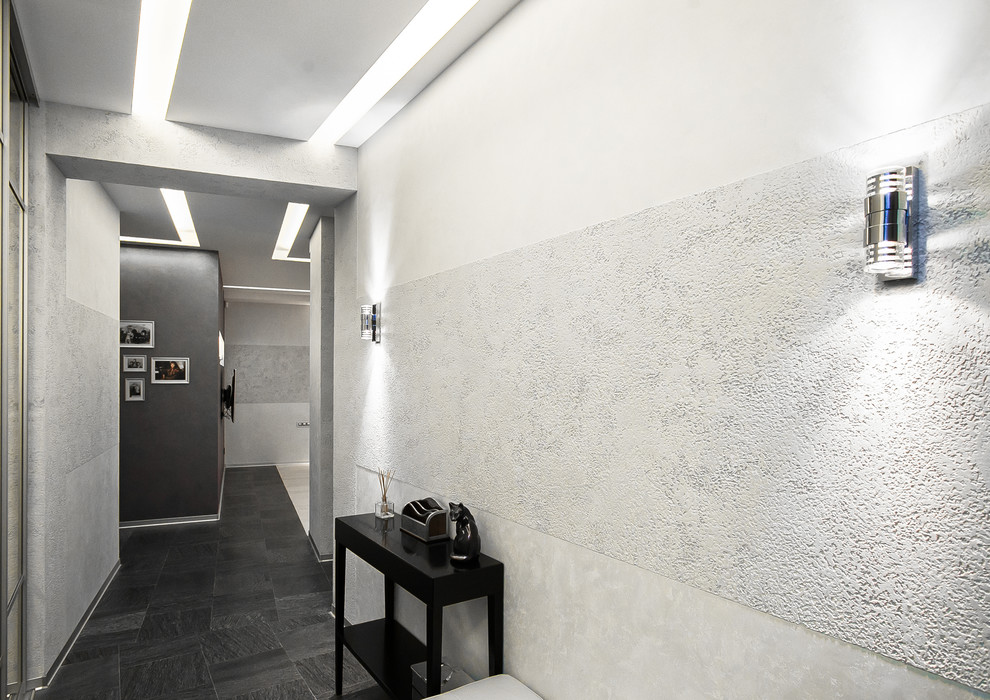 Design ideas for a large contemporary hallway in Moscow with black floor, grey walls and slate floors.