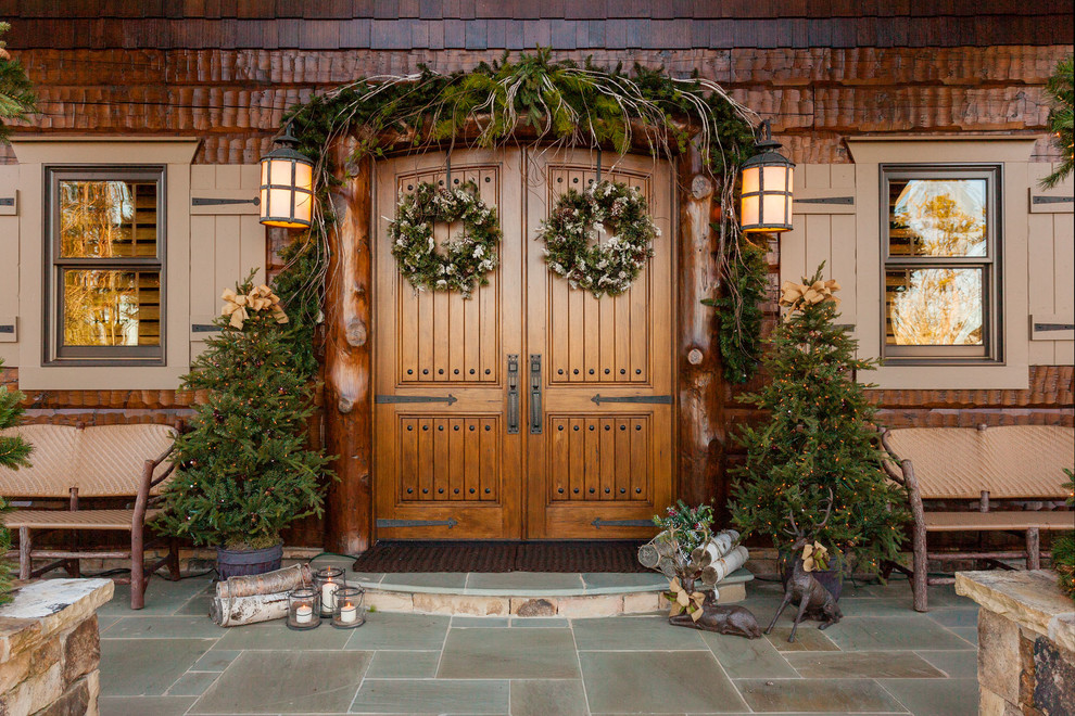Large mountain style brown wood house exterior photo in Atlanta