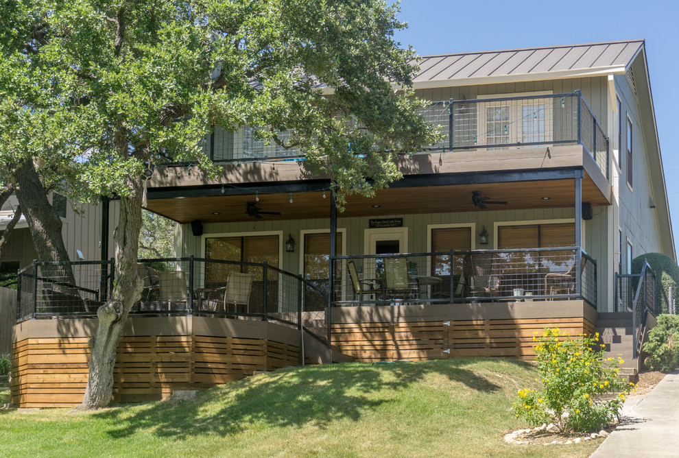 Inspiration for a large rustic backyard balcony deck remodel in Austin