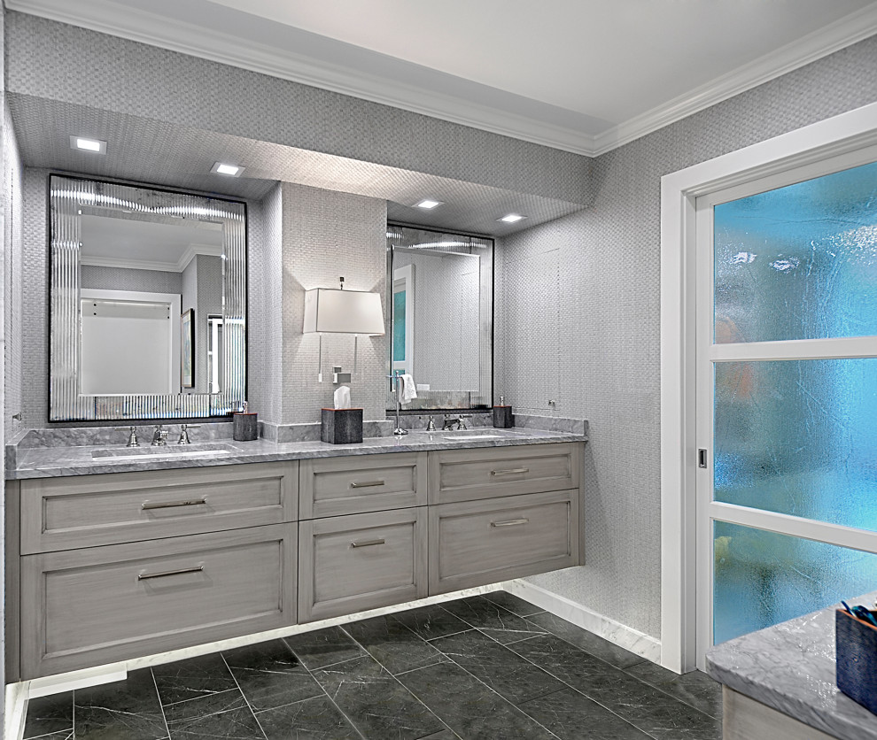 Bathroom - mid-sized transitional master porcelain tile, gray floor, double-sink and wallpaper bathroom idea in Chicago with recessed-panel cabinets, gray cabinets, gray walls, an undermount sink, marble countertops, gray countertops and a floating vanity