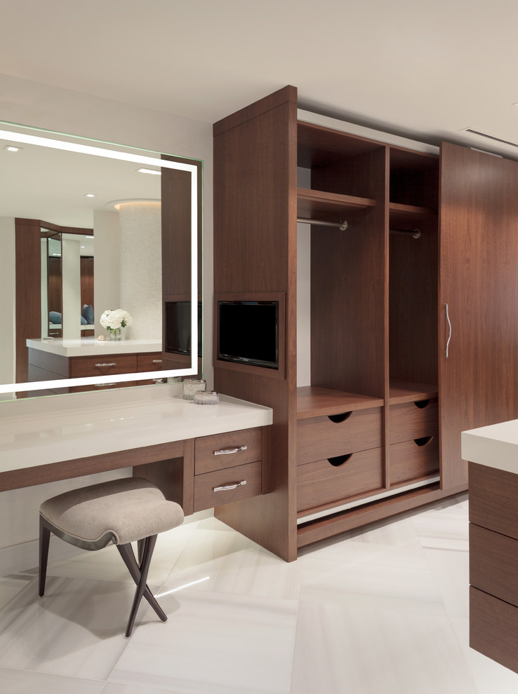 Inspiration for a large contemporary gender-neutral walk-in wardrobe in Miami with flat-panel cabinets, dark wood cabinets and ceramic floors.