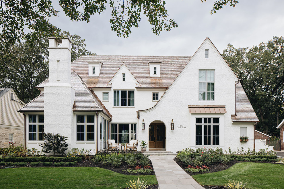 ASC Margaritaville - Large transitional white three-story painted brick house exterior photo in Chicago with a shingle roof and a brown roof