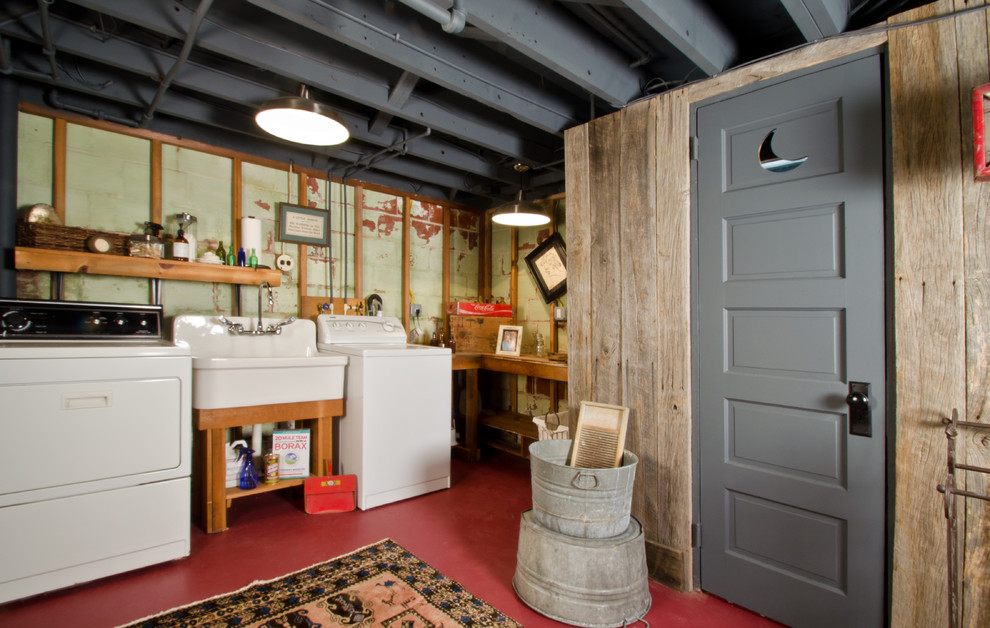 Inspiration for a mid-sized eclectic l-shaped utility room in DC Metro with a farmhouse sink, open cabinets, wood benchtops, green walls, concrete floors, a side-by-side washer and dryer and medium wood cabinets.