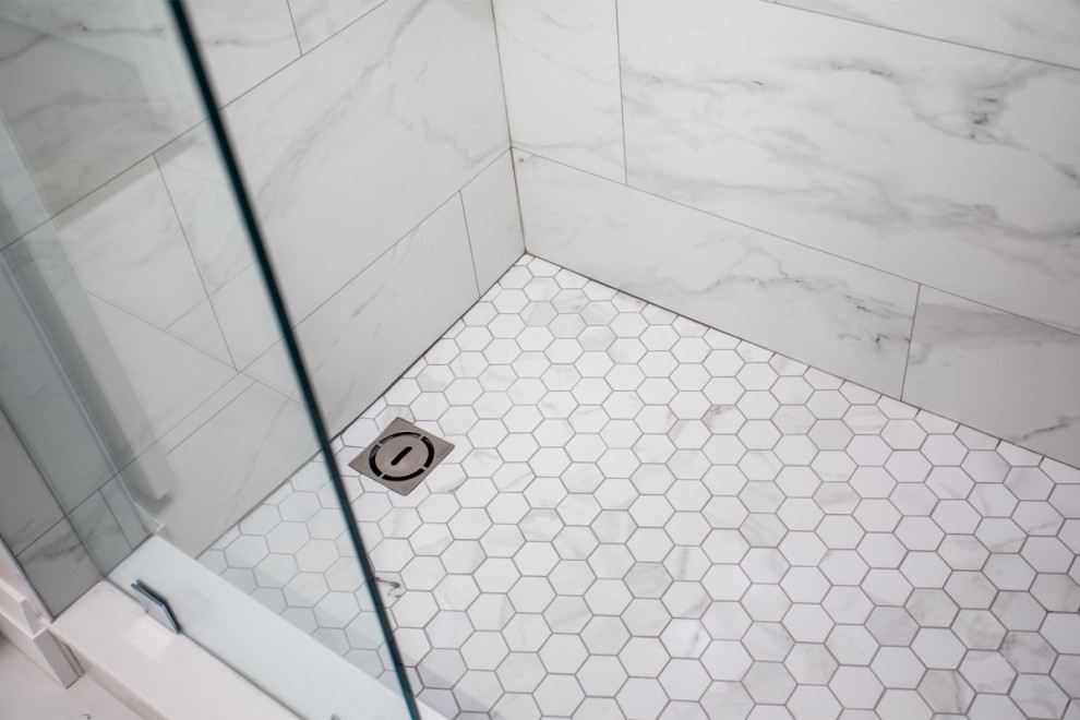 Inspiration for a large industrial 3/4 white tile and porcelain tile porcelain tile, white floor and single-sink alcove shower remodel in Toronto with shaker cabinets, white cabinets, a one-piece toilet, gray walls, an undermount sink, quartz countertops, a hinged shower door, white countertops and a freestanding vanity