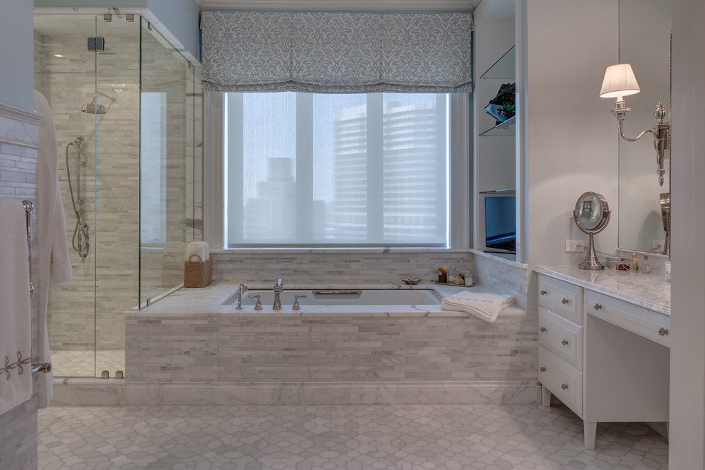 Inspiration for a large traditional master bathroom in Philadelphia with white cabinets, an open shower, gray tile, an undermount sink, raised-panel cabinets, marble benchtops, an undermount tub, blue walls and marble floors.