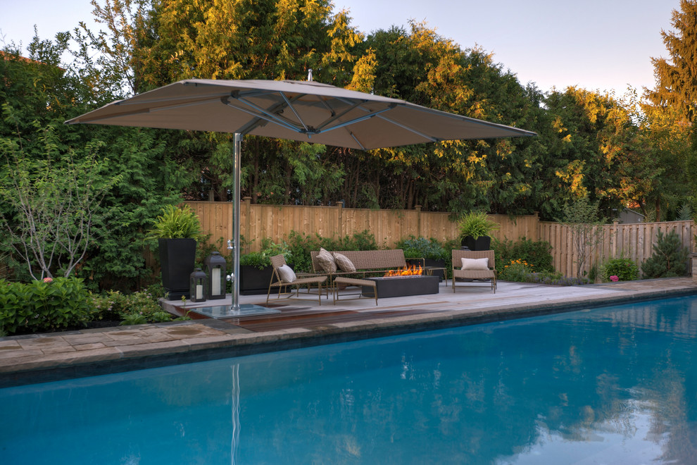Design ideas for a contemporary rectangular pool in Toronto with decking.