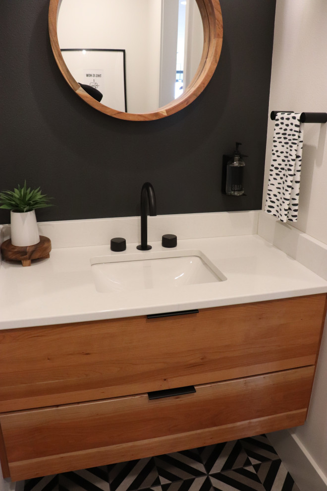 Large transitional l-shaped medium tone wood floor and brown floor open concept kitchen photo with a single-bowl sink, shaker cabinets, white cabinets, quartz countertops, gray backsplash, subway tile backsplash, stainless steel appliances, an island and white countertops