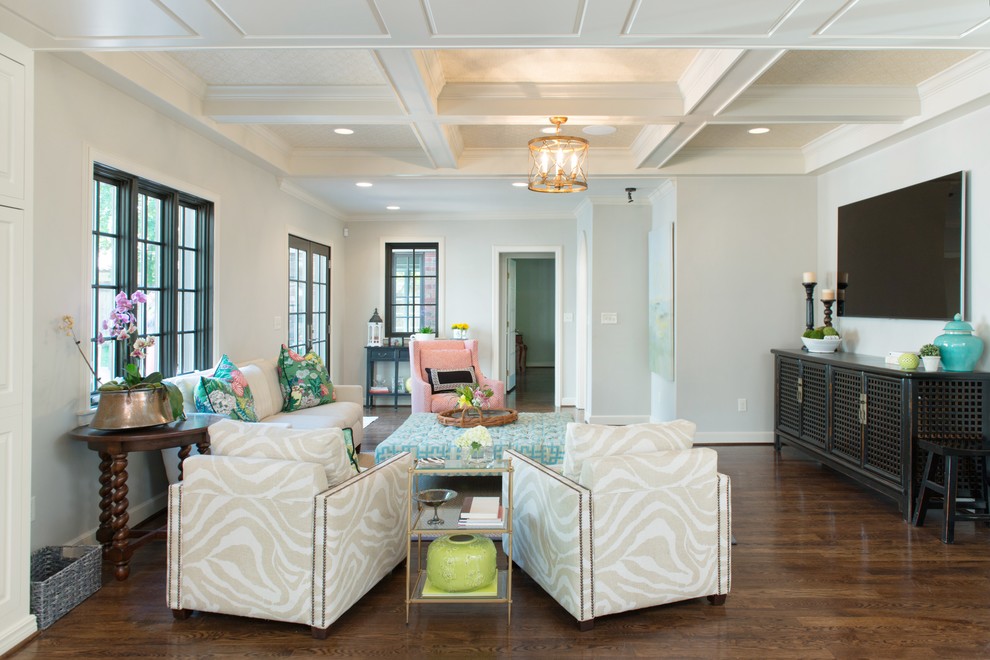Inspiration for a traditional living room in Orlando with grey walls, dark hardwood floors and a wall-mounted tv.