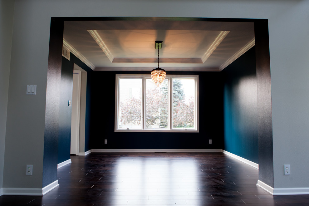 Large transitional dark wood floor and brown floor home design photo with blue walls