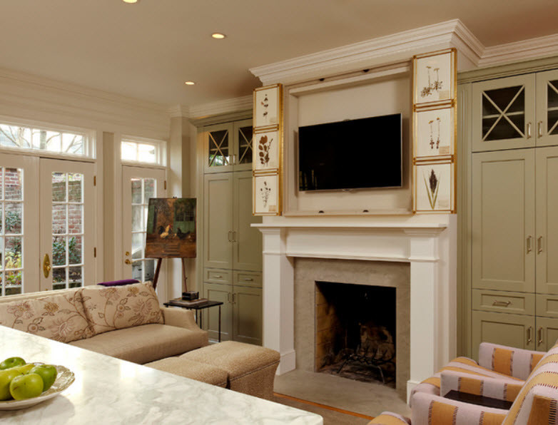 Design ideas for a small transitional open concept family room in Chicago with a library, beige walls, medium hardwood floors, a standard fireplace, a wood fireplace surround and a concealed tv.