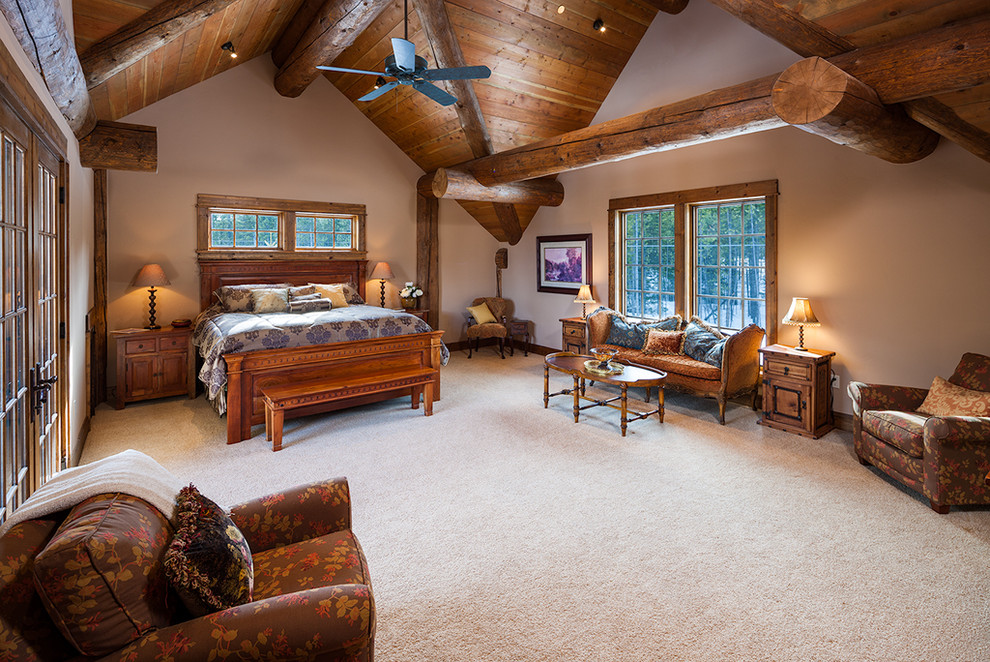 Example of a huge mountain style master bedroom design