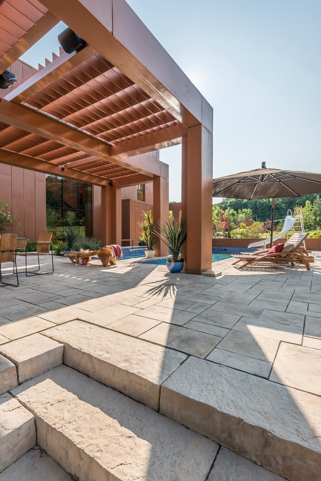 Pool - large transitional concrete and freeform pool idea in Montreal