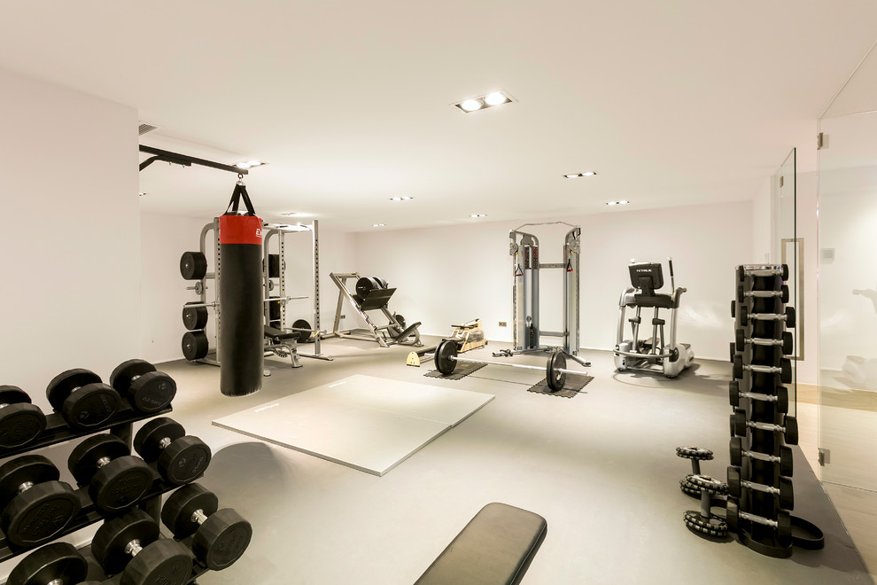 Inspiration for a large contemporary home weight room in Other with white walls.