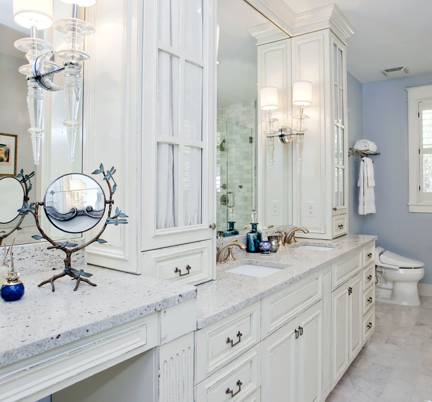 Design ideas for a large traditional master bathroom in Tampa with recessed-panel cabinets, white cabinets, a freestanding tub, a corner shower, a one-piece toilet, multi-coloured tile, subway tile, blue walls, ceramic floors, an undermount sink and marble benchtops.