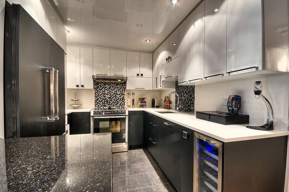 Photo of a small contemporary u-shaped eat-in kitchen in Ottawa with a single-bowl sink, flat-panel cabinets, quartz benchtops, white splashback, ceramic splashback, stainless steel appliances, ceramic floors and a peninsula.
