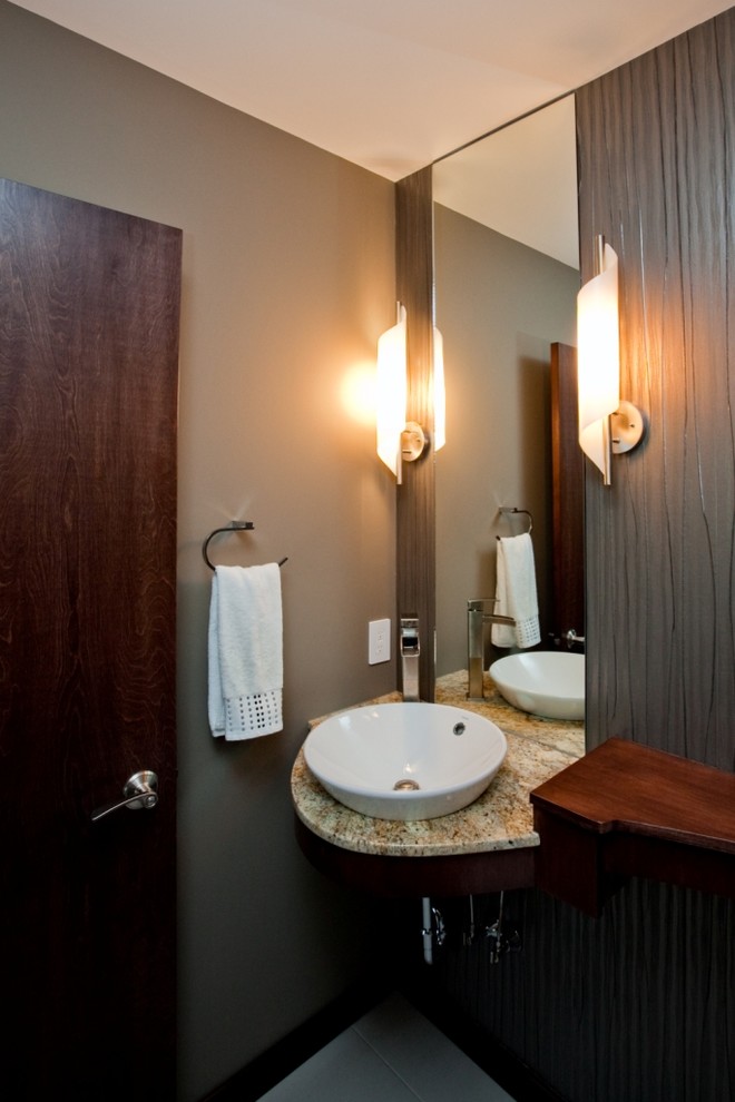 This is an example of a mid-sized contemporary 3/4 bathroom in Other with open cabinets, dark wood cabinets, a vessel sink, brown walls and granite benchtops.