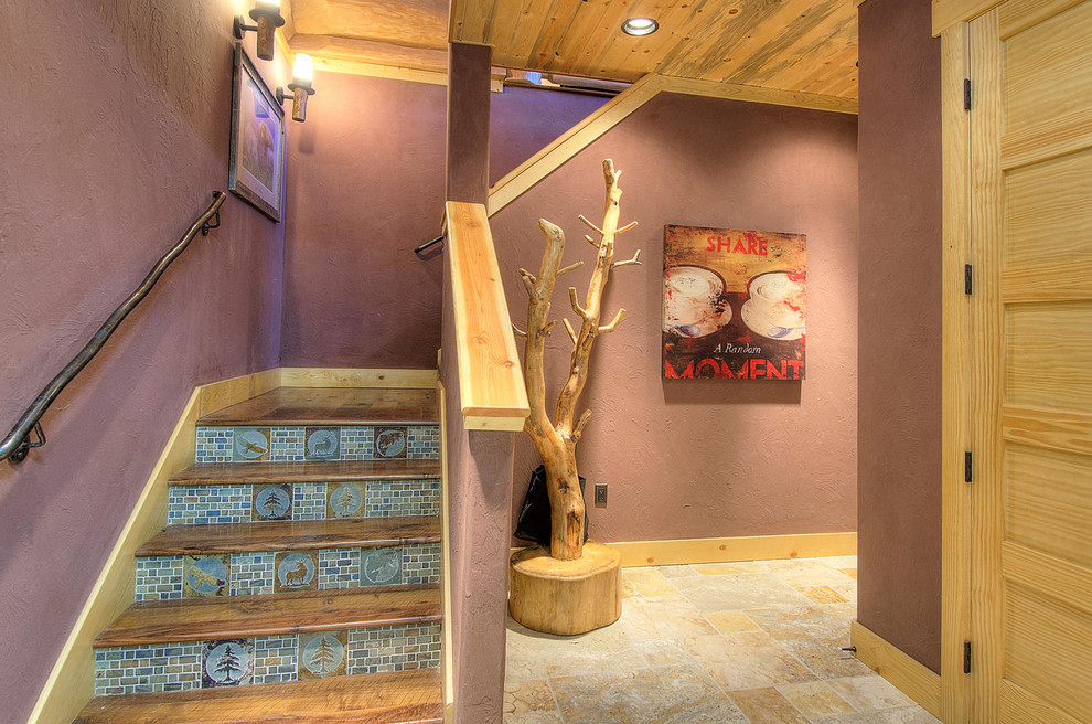 Example of a mid-sized mountain style wooden l-shaped staircase design in Denver with tile risers