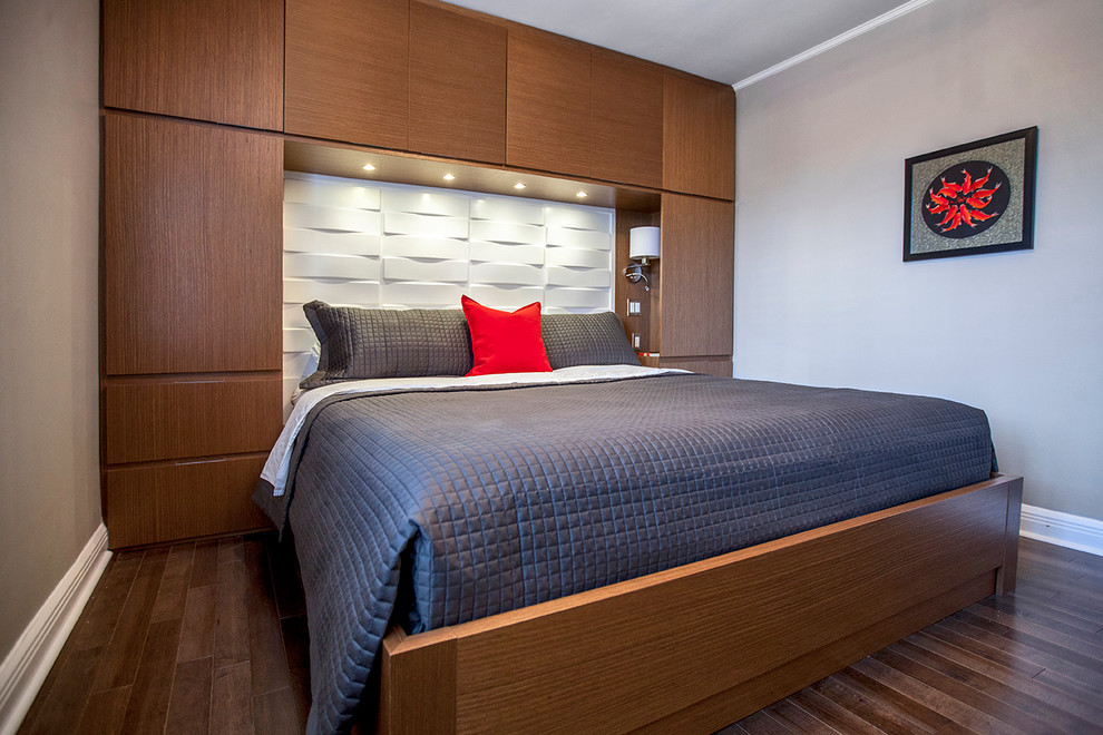 This is an example of a mid-sized contemporary master bedroom in Montreal with grey walls and dark hardwood floors.