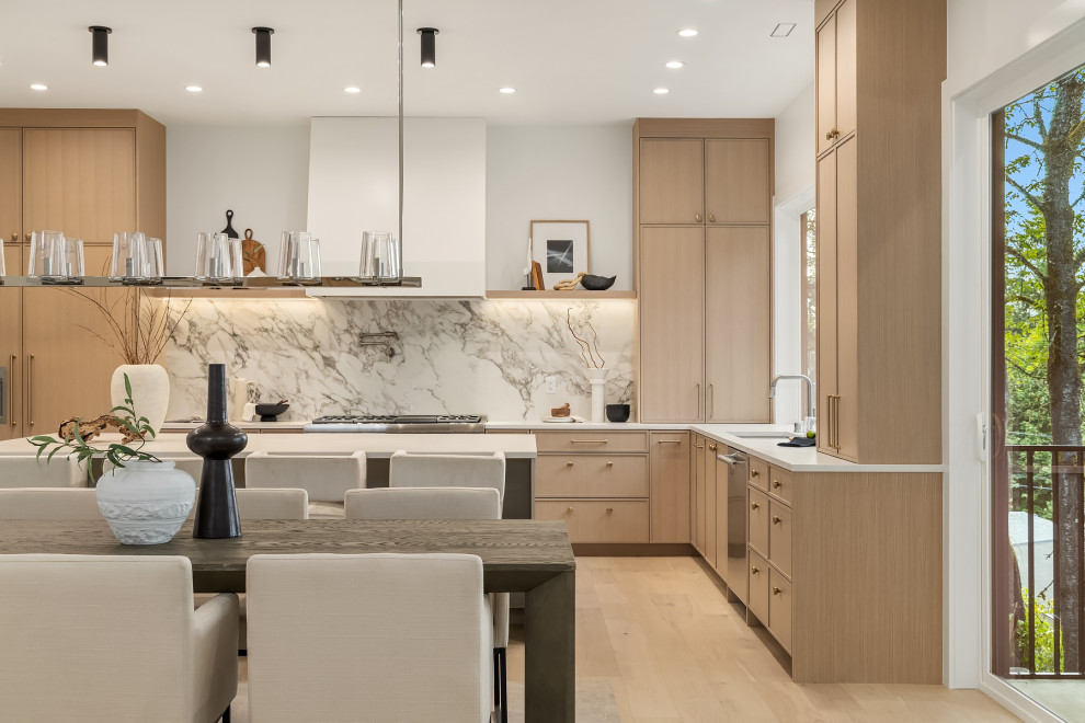 Inspiration for a large contemporary l-shaped light wood floor eat-in kitchen remodel in Seattle with a single-bowl sink, shaker cabinets, light wood cabinets, quartz countertops, multicolored backsplash, porcelain backsplash, an island, white countertops and paneled appliances