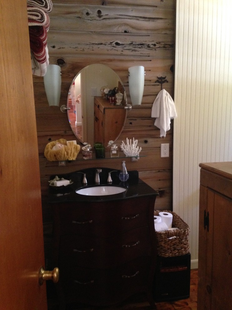Alcove bathtub - small rustic master medium tone wood floor alcove bathtub idea with an undermount sink, furniture-like cabinets, dark wood cabinets, quartz countertops and a two-piece toilet