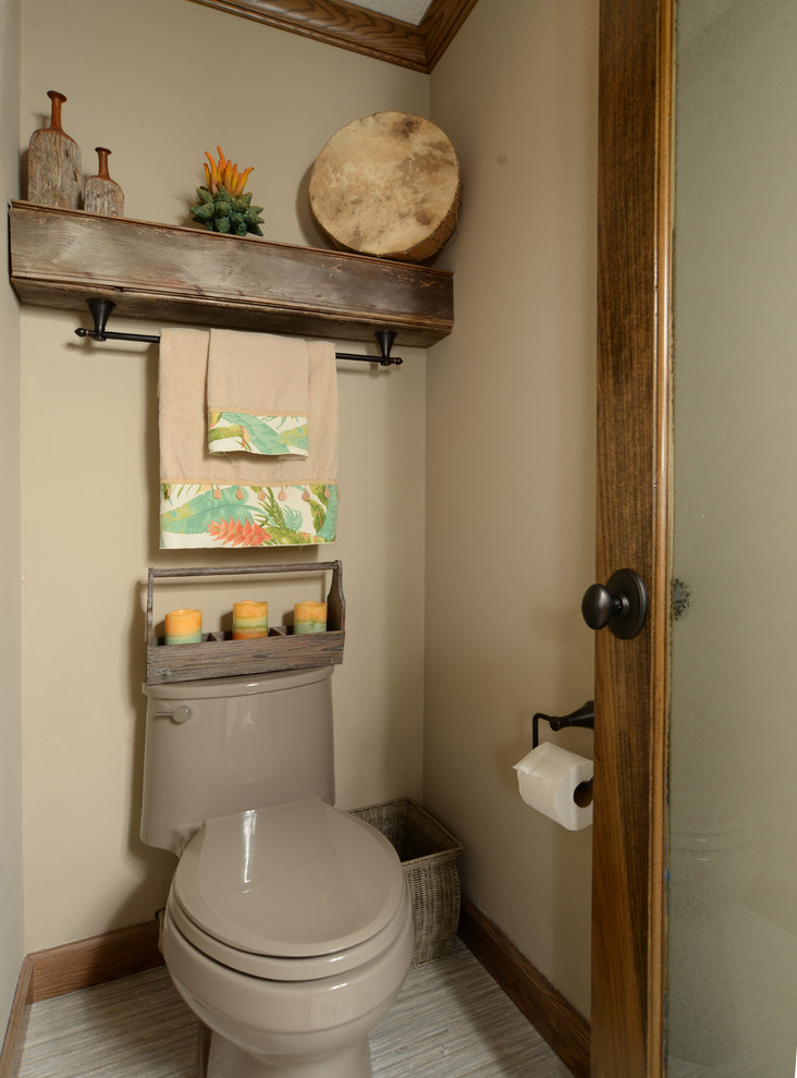 Large country powder room in Orlando with medium wood cabinets, multi-coloured tile and an undermount sink.