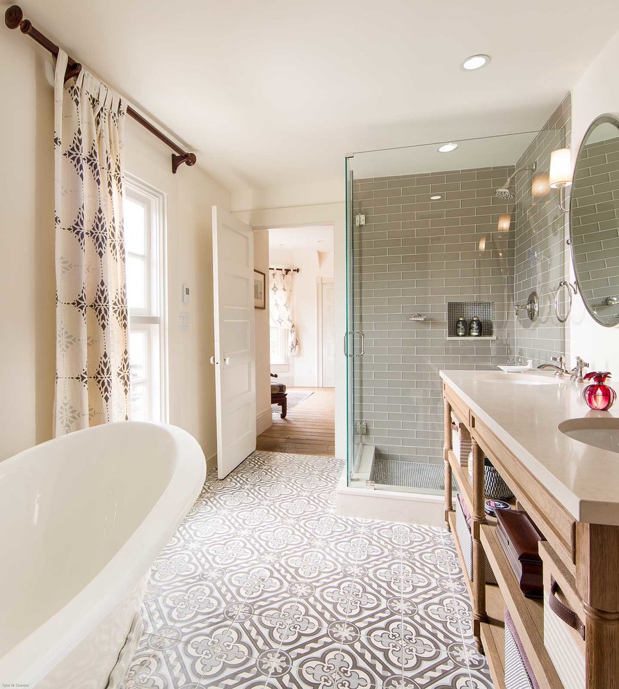 Photo of a mid-sized country master bathroom in San Francisco with open cabinets, light wood cabinets, a claw-foot tub, a corner shower, gray tile, glass tile, white walls, ceramic floors, an undermount sink and engineered quartz benchtops.