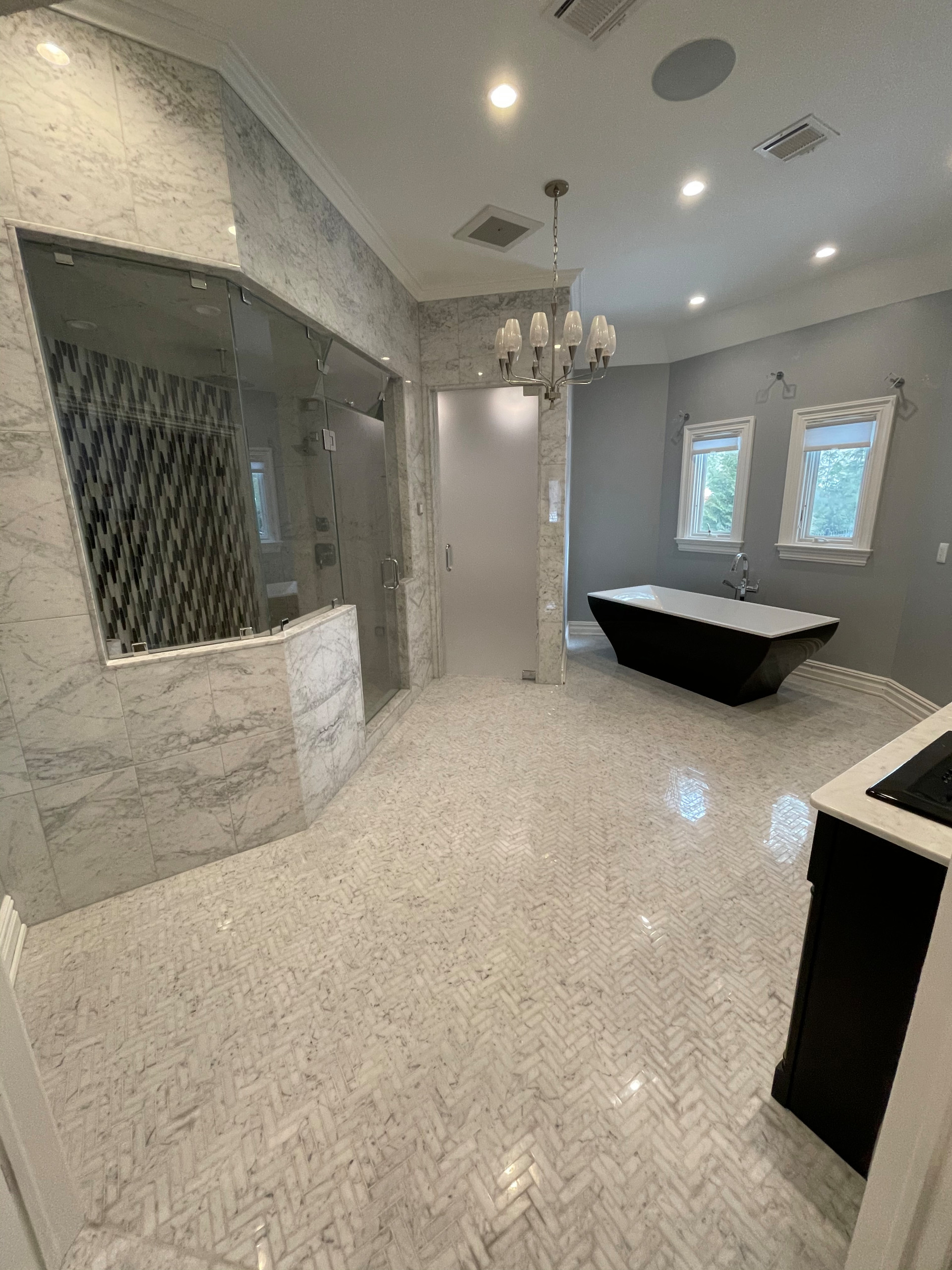 Herring bone floor gorgeous Carrera marble walls and shower all imported ITALY