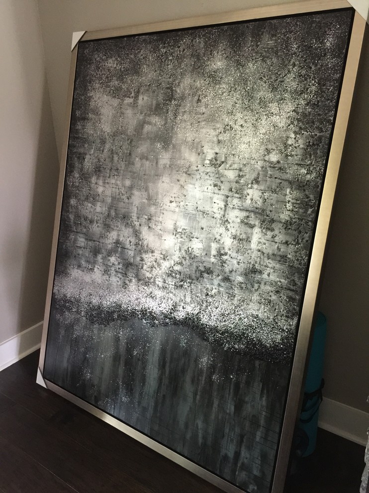 Art on each side of fireplace