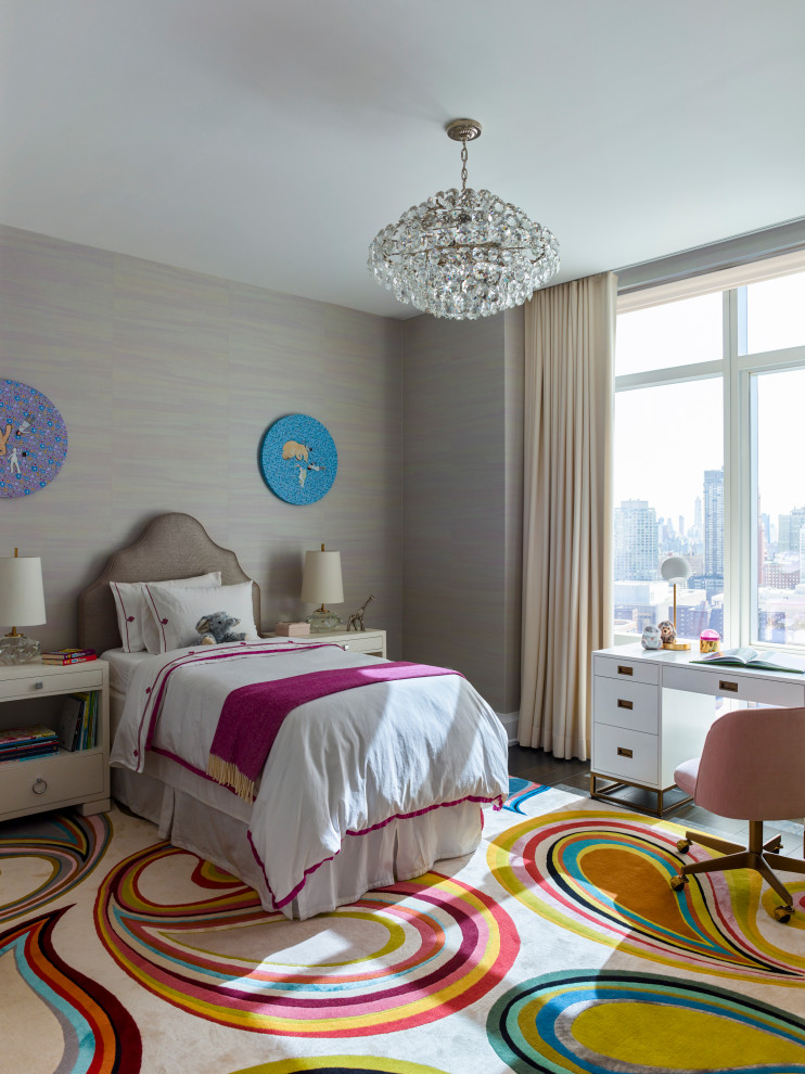 Photo of a transitional kids' bedroom for girls in New York with grey walls, dark hardwood floors, brown floor and wallpaper.