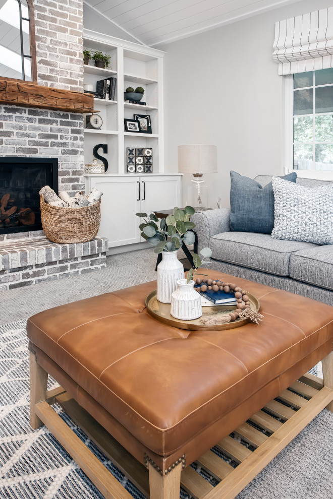 Example of a mid-sized farmhouse open concept carpeted, gray floor and shiplap ceiling family room design in Denver with gray walls, a standard fireplace, a brick fireplace and a tv stand