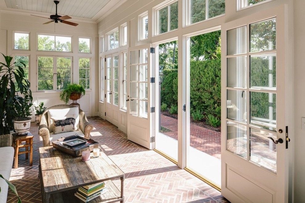 Design ideas for a large traditional sunroom in Other with brick floors, a standard ceiling, red floor and no fireplace.