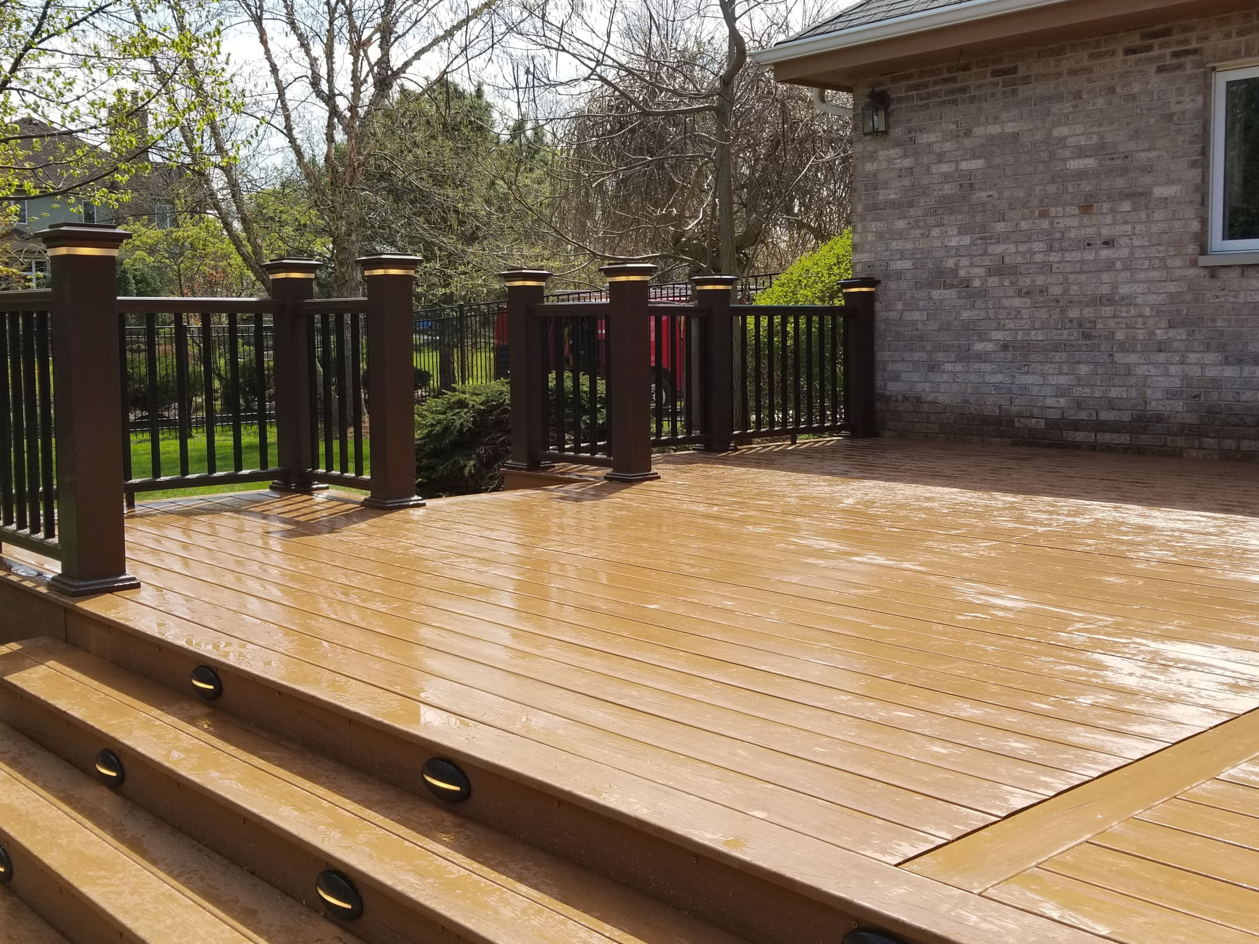 Composite deck with composite railing and lighting