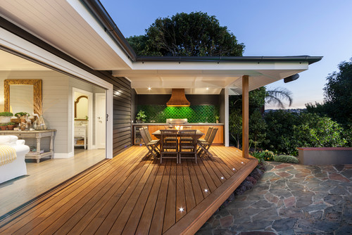 Lovely wooden patio with in floor lighting around the edges.