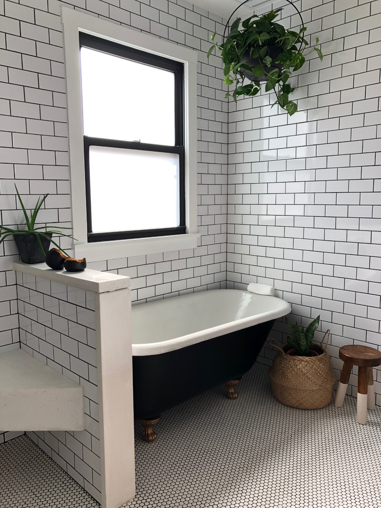 Inspiration for a mid-sized modern master wet room bathroom in St Louis with furniture-like cabinets, medium wood cabinets, a claw-foot tub, a one-piece toilet, white tile, ceramic tile, white walls, ceramic floors, a trough sink, wood benchtops, white floor and an open shower.