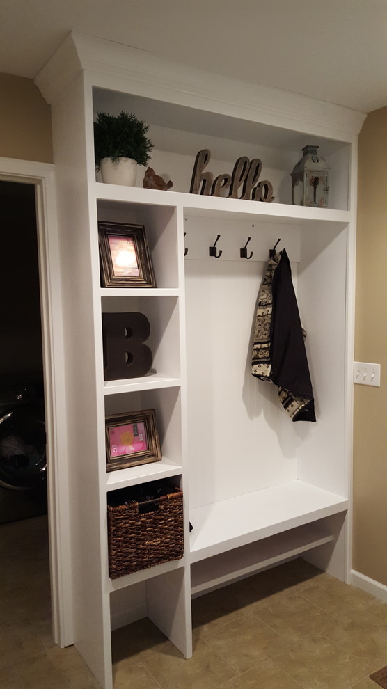 Inspiration for a small arts and crafts mudroom in Grand Rapids with beige walls, vinyl floors and beige floor.