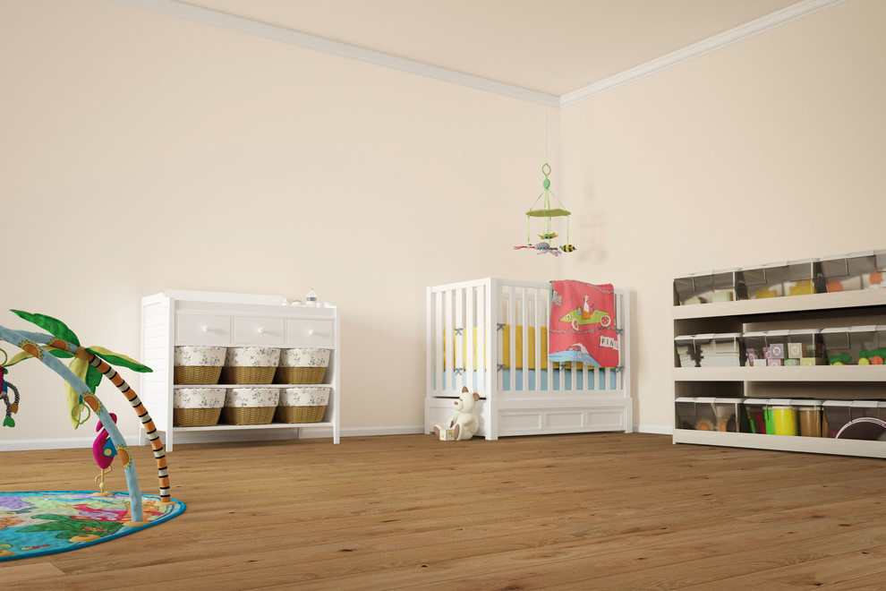 Photo of a mid-sized transitional gender-neutral nursery in Vancouver with beige walls, light hardwood floors and beige floor.