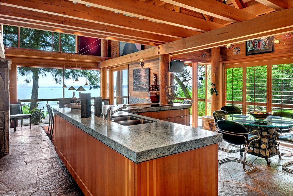 Photo of a country u-shaped eat-in kitchen in Seattle with granite benchtops and a peninsula.