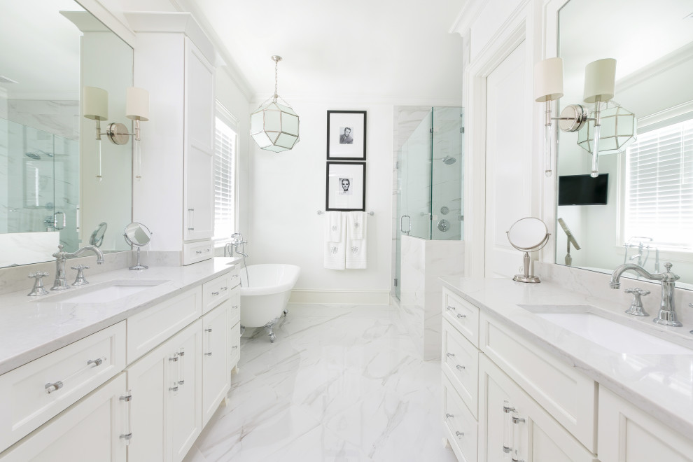 This is an example of a large transitional master bathroom in Charleston with recessed-panel cabinets, white cabinets, a claw-foot tub, white walls, an undermount sink, white floor, grey benchtops, a double vanity, a built-in vanity, an open shower, black and white tile, ceramic tile, ceramic floors, engineered quartz benchtops, a hinged shower door and an enclosed toilet.