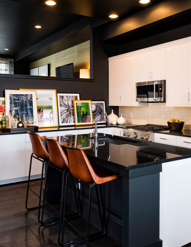 Inspiration for a contemporary kitchen in DC Metro with flat-panel cabinets, white splashback, subway tile splashback, stainless steel appliances, dark hardwood floors and with island.