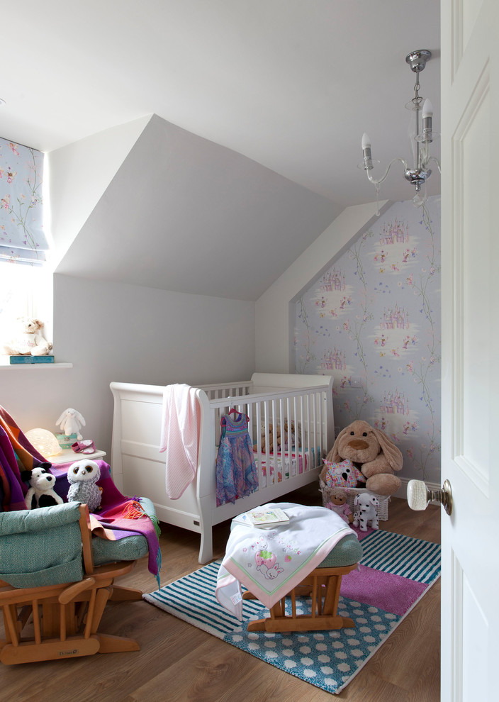 Inspiration for a country nursery for girls in Other with white walls, medium hardwood floors and beige floor.