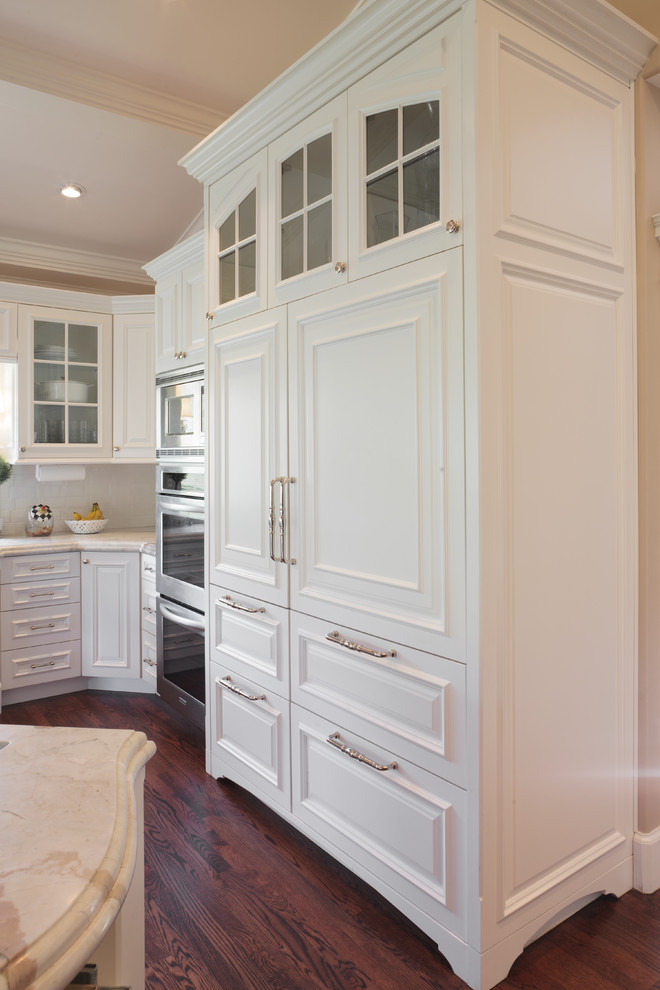 This is an example of a traditional kitchen in Salt Lake City with raised-panel cabinets.