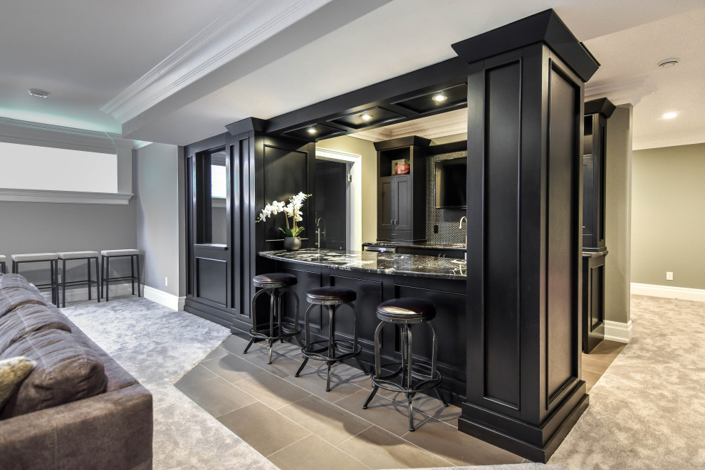 Photo of a contemporary galley seated home bar in Edmonton with black cabinets, granite benchtops and black benchtop.