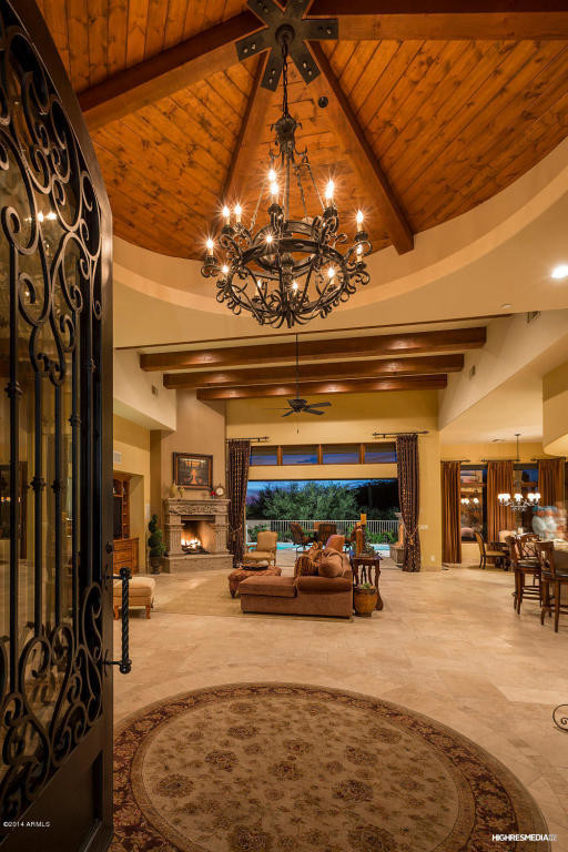 Mid-sized transitional travertine floor foyer photo in Phoenix with beige walls and a metal front door